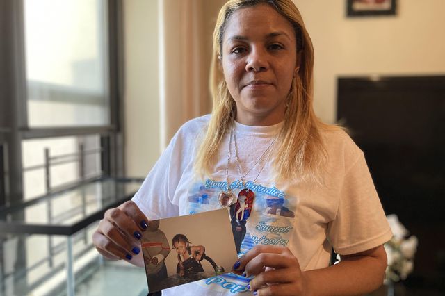 Lezandre Khadu holds a childhood photo of her son Stephan Khadu, who passed away after being held in the Vernon C. Bain Center in September.